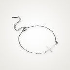 Pulsera Cruz de lado plateada
