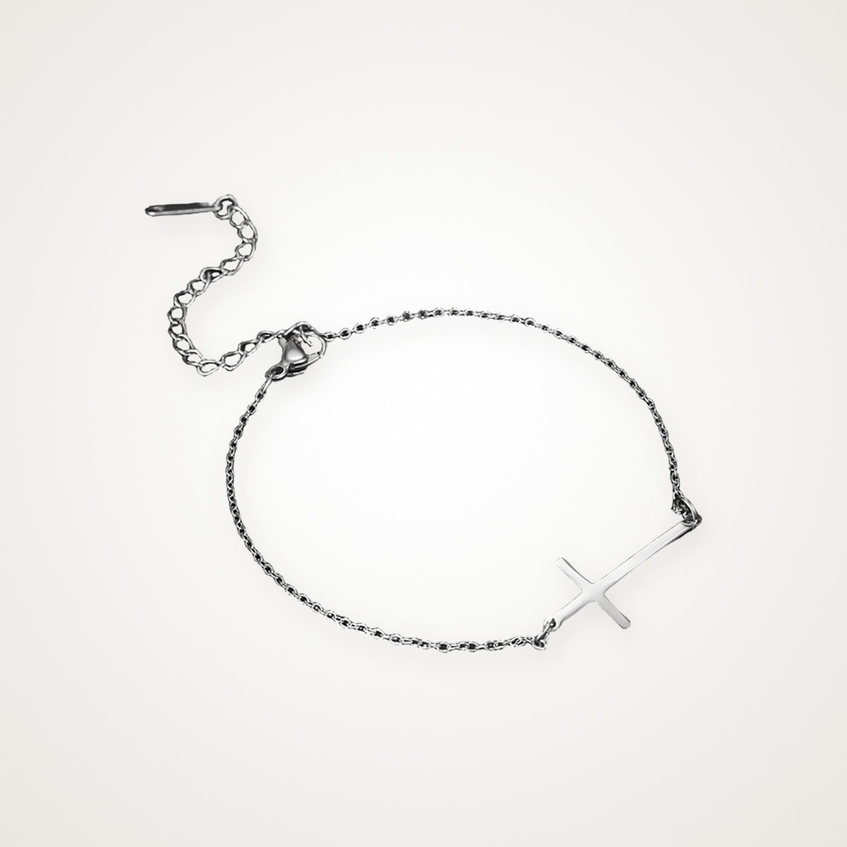 Pulsera Cruz de lado plateada