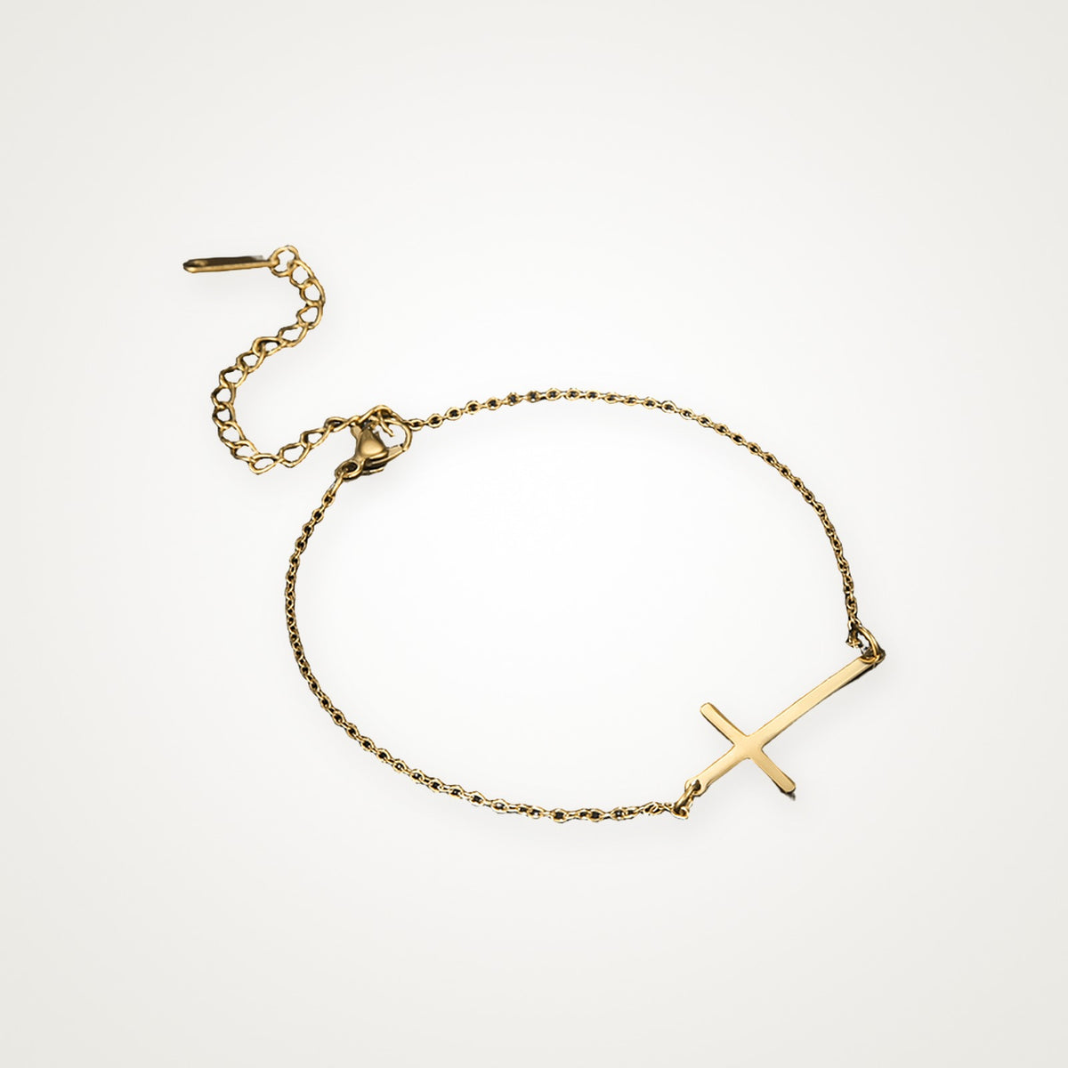 Pulsera Cruz de lado dorada
