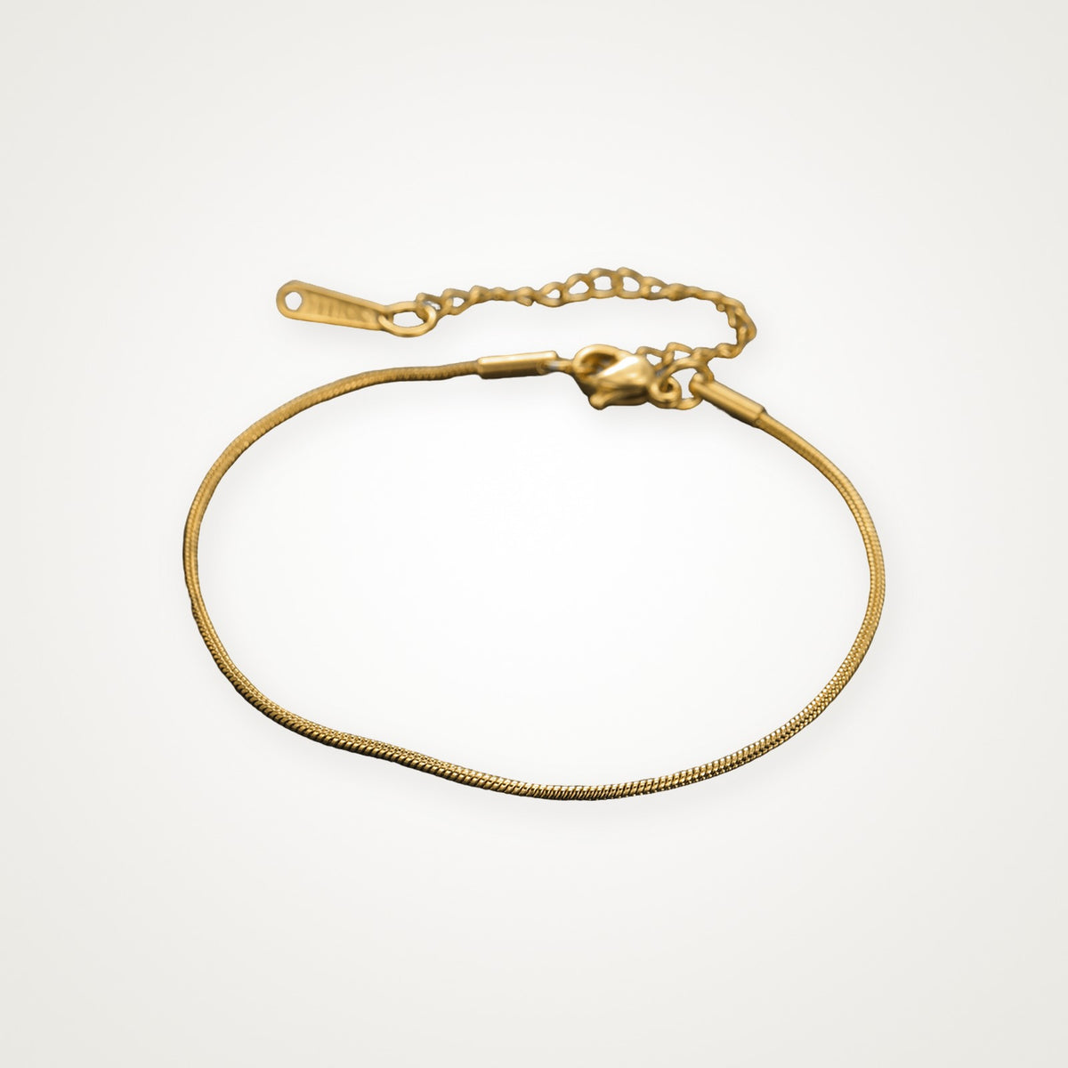 Pulsera Serpiente fina dorada 1.2 mm 17–22 cm